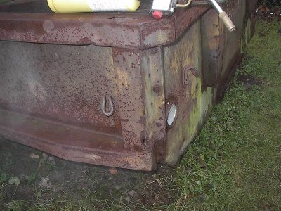 Heres where I started.  There is also a bolt up under the channel.  Don't forget it.  I used my MAPP torch to loosen the rusted bolts.  A 9/16ths deep socket and wrench were used.