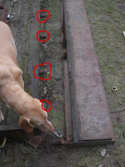 Here is the side off.  Notice the attach points sticking out from under the bed.  There is also an L channel that (in my case is rusted away) that support the outermost board.